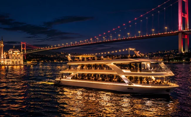 Standard dinner cruise boat illuminated on the Bosphorus at night, Istanbul